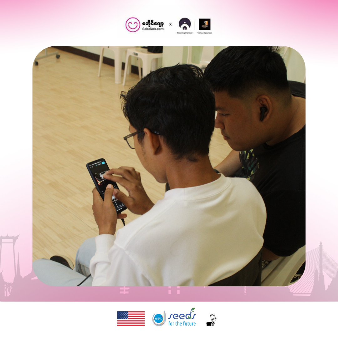 Workshop participants reviewing video edits